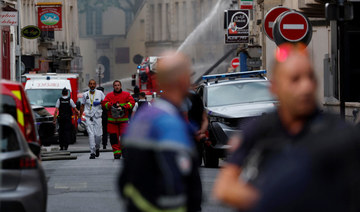 Rescuers comb through rubble of Paris building blast